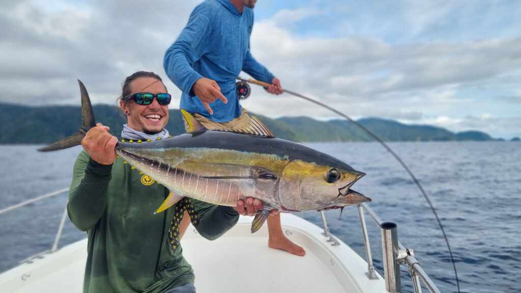 Anglers fight yellowfin tuna in Bahia Solano, Colombia